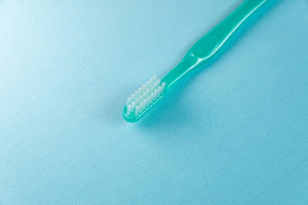 Green Toothbrush Blue Background — Stock Photo, Image