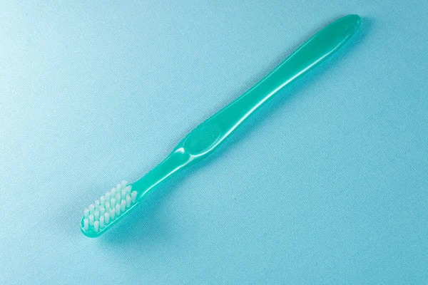 Green Toothbrush Blue Background — Stock Photo, Image