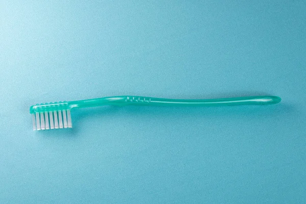 Green Toothbrush Blue Background — Stock Photo, Image