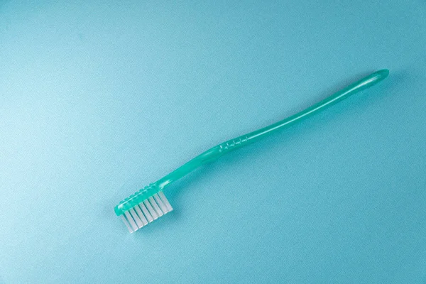 Green Toothbrush Blue Background — Stock Photo, Image