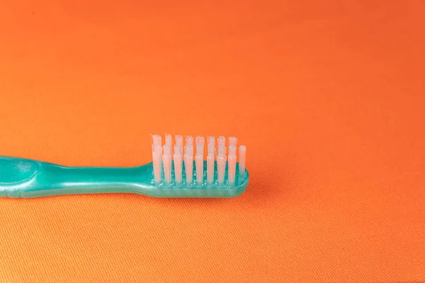 Green Toothbrush Orange Background — Stock Photo, Image