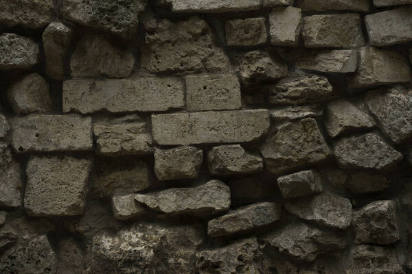 Старая каменная стена как абстрактный фон
