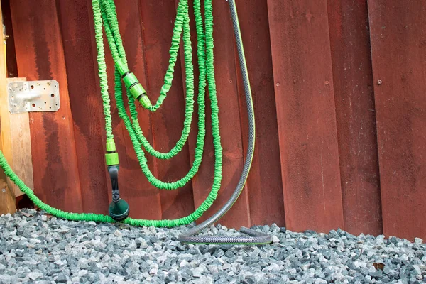 Part Flexible Green Garden Hose Red House Wall Stock Picture