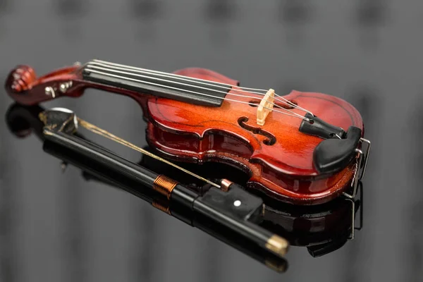 Violin and bow on grey background