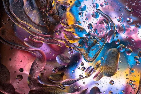 Colorful liquid abstract textured swirls background. Water splash. Macro photography