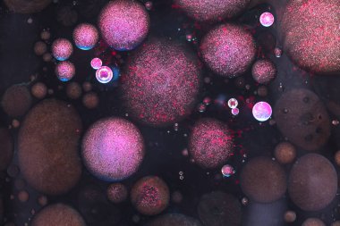 Pembe ve siyah sıvı su kabarcıklar soyut arka plan. Makro fotoğrafçılık