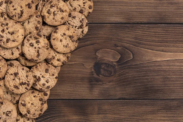 Chock chip cookie on wooden background with copy space. Top view. Flat lay