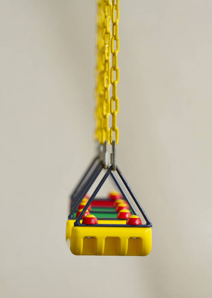 Row of colorful swing on white background