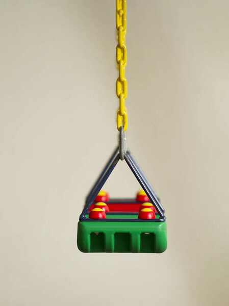 Green swing on white background