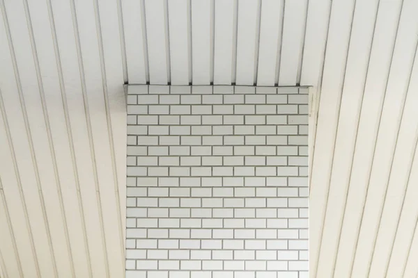 White tiled pattern and white ceiling pattern