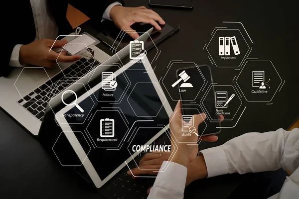 Compliance Virtual Diagram for regulations, law, standards, requirements and audit.co working team meeting concept,businessman using smart phone and digital tablet and laptop computer and name tag in modern office