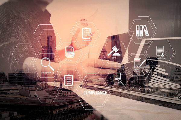 Compliance Virtual Diagram for regulations, law, standards, requirements and audit.businessman working with smart phone and digital tablet and laptop computer and document in modern office.