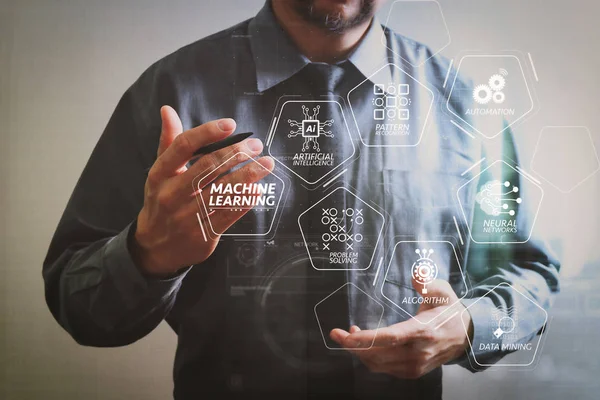 Machine learning technology diagram with artificial intelligence (AI),neural network,automation,data mining in VR screen.success businessman open his hand,working touch screen computer,front view.