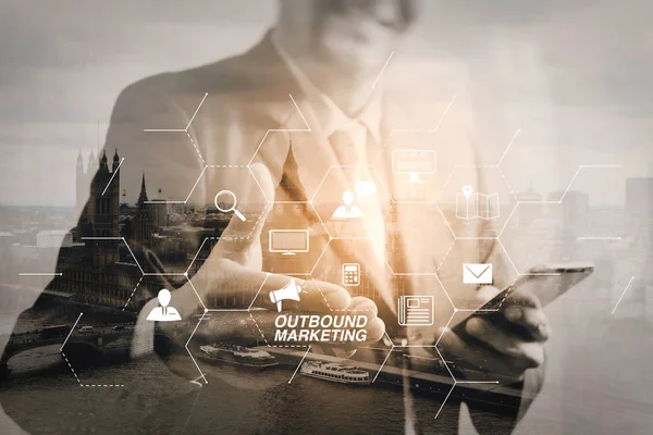 Outbound marketing business virtual dashboard with Offline or interruption marketing.Double exposure of success businessman open his hand with London building,city,river,Bigben,front view,filter effect