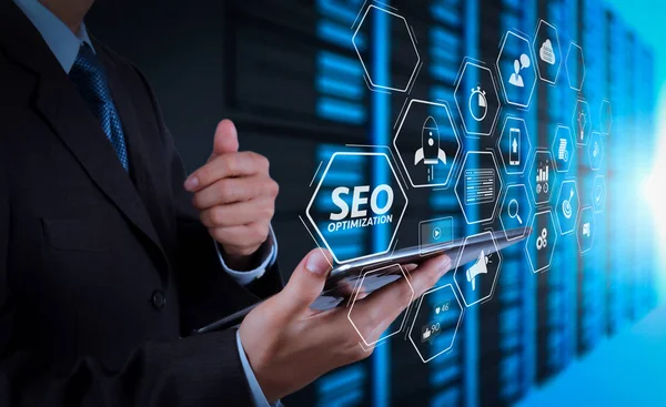 Seo Optimization for website with mobile website and Landing page virtual diagram.businessman hand using tablet computer and server room background