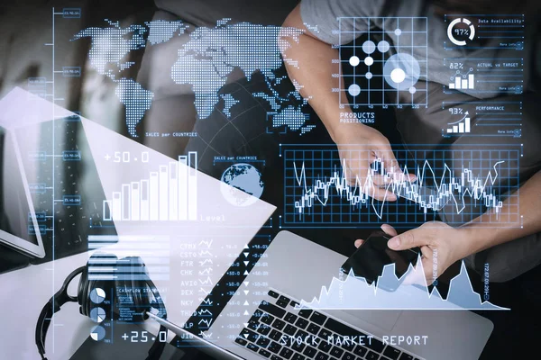 Investor analyzing stock market report and financial dashboard with business intelligence (BI), with key performance indicators (KPI).hipster using smart phone and laptop computer and holding credit card for payments online.