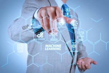 Machine learning technology diagram with artificial intelligence (AI),neural network,automation,data mining in VR screen.Businessman hand pressing an imaginary button on virtual screen clipart