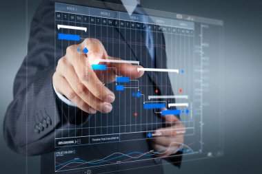 Project manager working and update tasks with milestones progress planning and Gantt chart scheduling virtual diagram.Businessman hand pressing an imaginary button on virtual screen clipart