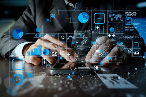 Financial report data of business operations (balance sheet and income statement and diagram) as Fintech concept.Businessman hand using mobile phone with digital business strategy concept