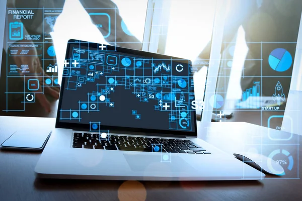 Financial report data of business operations (balance sheet and income statement and diagram) as Fintech concept.Office workplace with blank screen laptop and two colleagues discussing data