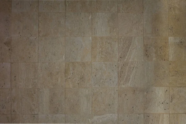 Wall beige tiles.