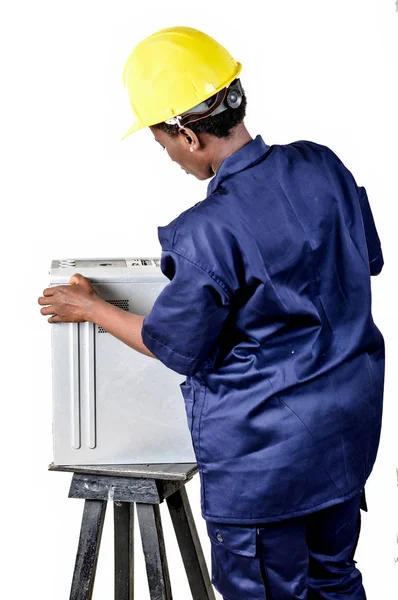 Young female computer maintenance worker checks the status of a computer CPU