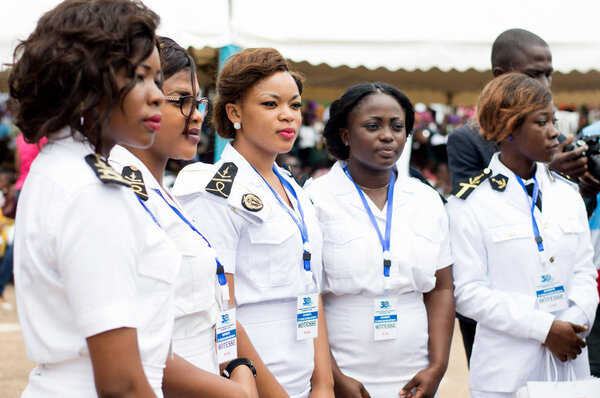 Abidjan, Ivory Coast - August 3, 2017: shoulder pad ceremony to students leaving the Maritime Academy. standing female sailor team wearing hospitality badges