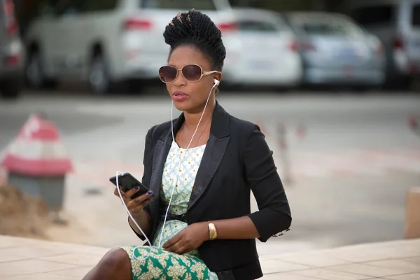 Young Woman Wearing Black Jacket Sunglasses Sits Listens Music Her — Stock Photo, Image