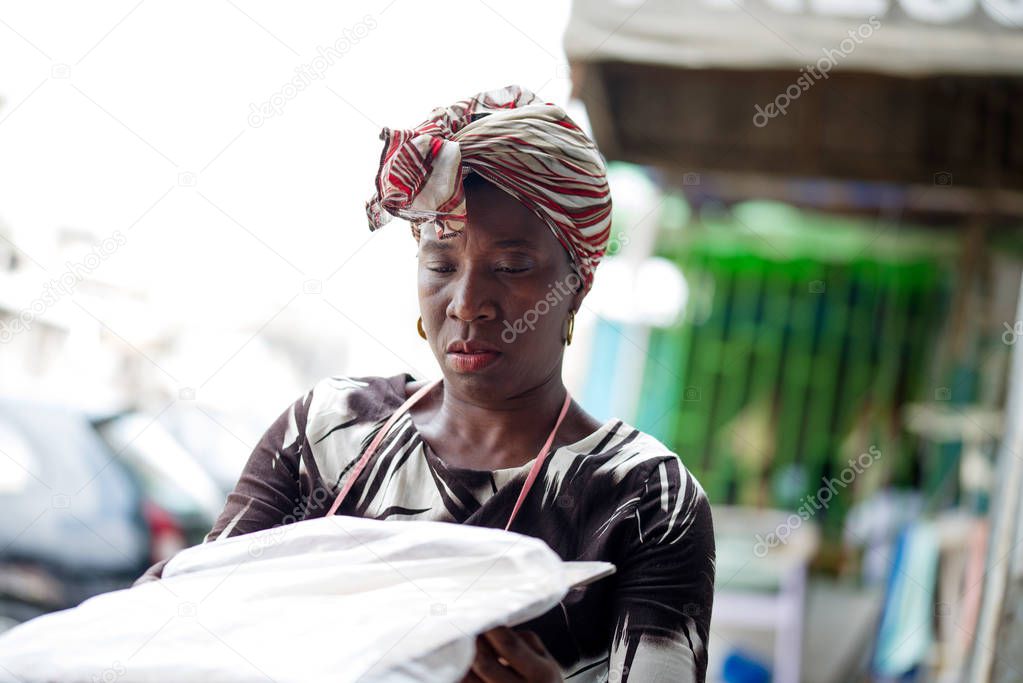 saleswoman woman with a wooden tray in her hands