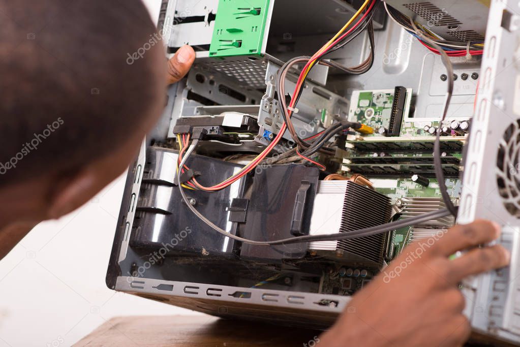 technician repairing computer equipment.