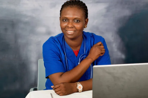 Young smiling woman doctor in the office — Stock Photo, Image