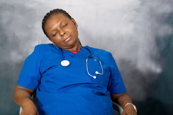 Female doctor sleeping at work — Stock Photo, Image