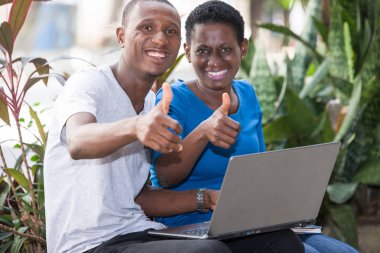closeup of young students with laptop, happy. clipart