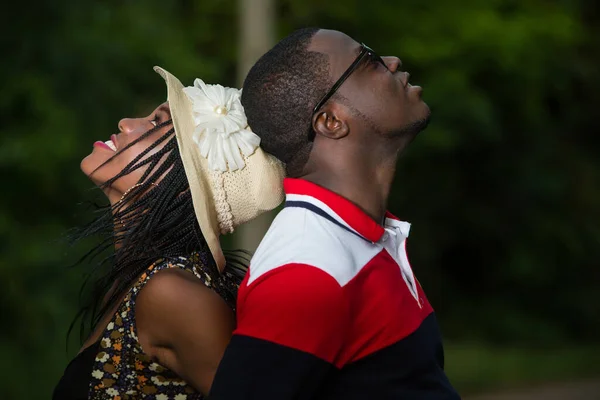 Young Couple Standing Park Back Back Looking Smiling — Stock Photo, Image