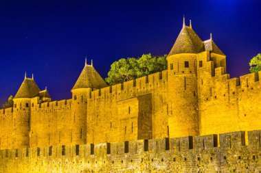 Night view over illuminated fortification of Carcassonne, Franc clipart