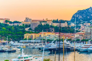 Old town of Monaco overlooking port Hercule during sunse clipart
