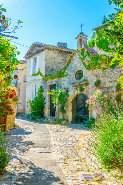 A narrow street in the old town of Vaison-la-Romaine in Franc