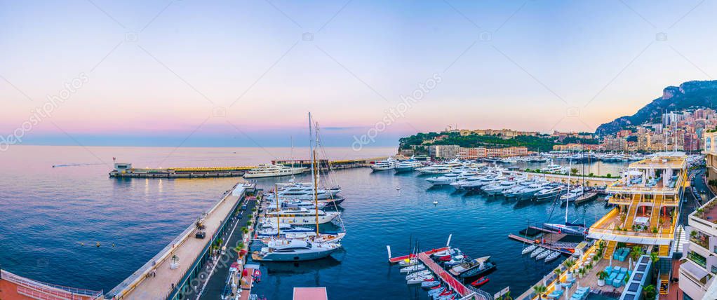 Old town of Monaco overlooking port Hercule during sunse