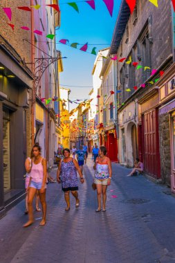 L'ISLE-SUR-LA-SORGUE, FRANCE, JUNE 24, 2017:Narrow street in L'Isle sur la sorgue village in Franc
