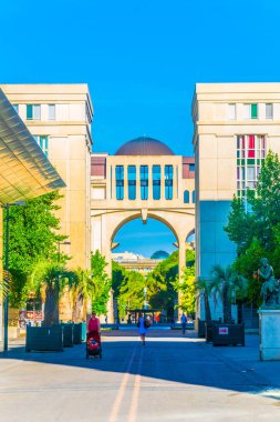 MONTPELLIER, FRANCE, JUNE 26, 2017: A narrow street leading to the Place de Thessalie in Montpellier, Franc clipart