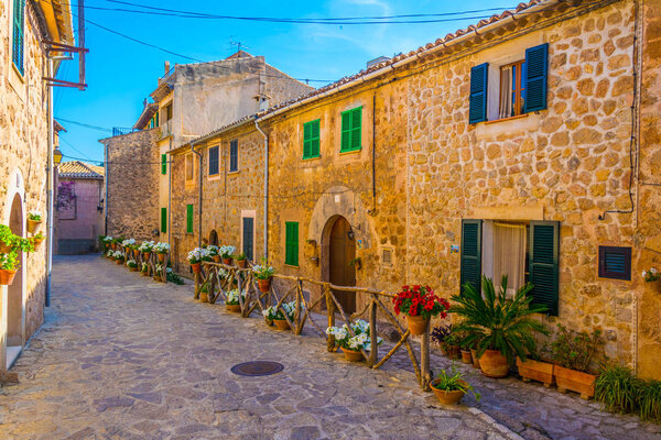 View of a narrow street in the spanish town Valldemossa at Mallorc
