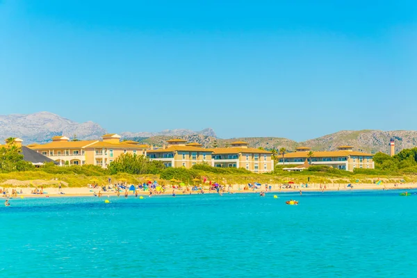Holiday resorts stretched alongside Alcudia beach on Mallorca, Spai