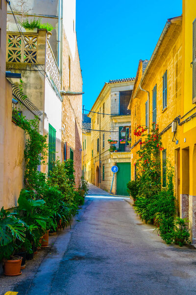 View of a narrow street in the old town of Alcudia, Mallorca, Spai