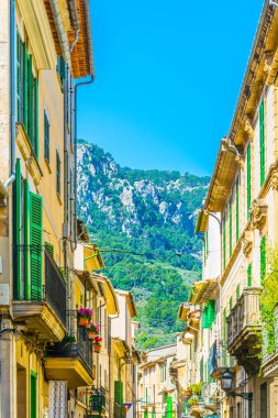 a narrow street in the spanish town Soller at Mallorc clipart