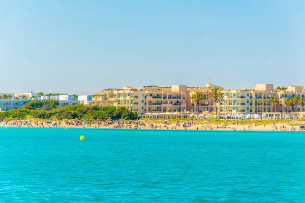 Holiday resorts stretched alongside Alcudia beach on Mallorca, Spai