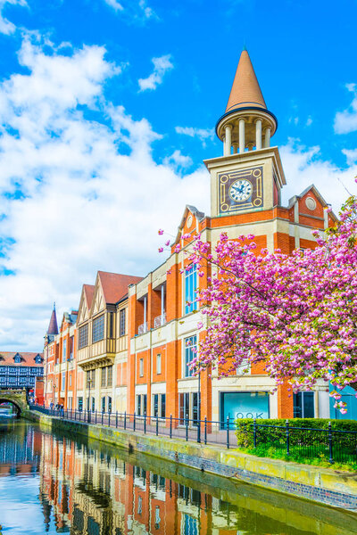 River Witham passes old brick buildings in central Lincoln, Englan