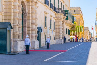 VALLETTA, MALTA, MAY 3, 2017: View of the national guard in front of the grandmasters palace in Valletta, Malt clipart