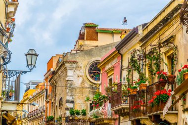 View of a narrow street in Taormina, Sicily, Ital clipart