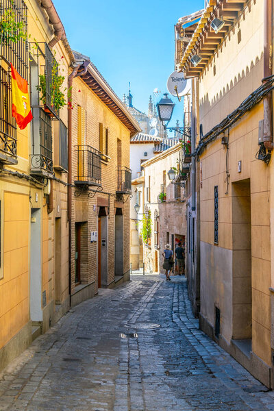 a narrow street in the historical center of Toledo, Spai
