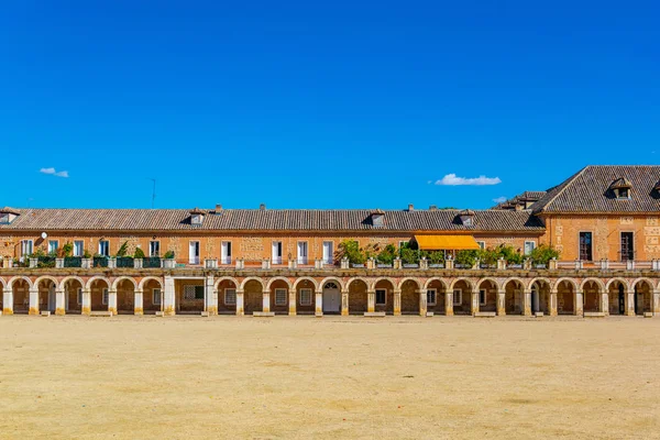 Covered arcade of royal palace at Aranjuez behind fence, Spai